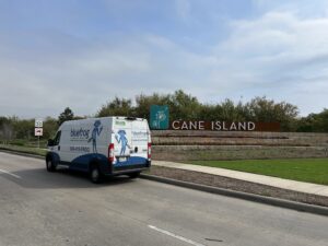 A bluefrog Plumbing and Drain service vehicle at Cane Island in Katy Texas