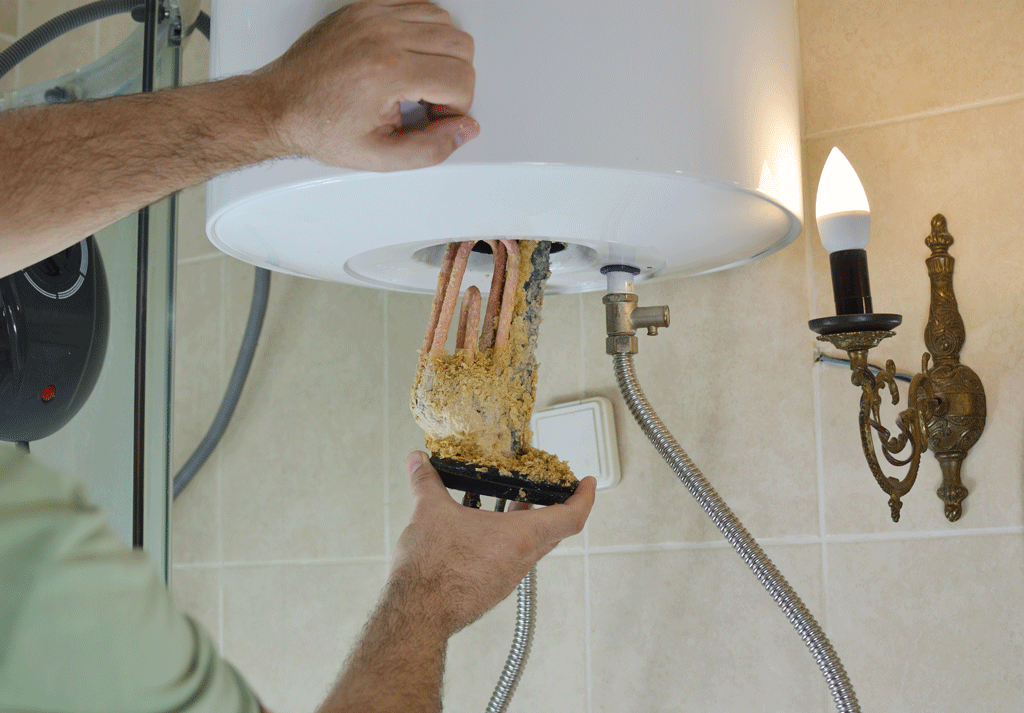 man fixing heating element in water heater water heater repair katy tx sugarland tx 