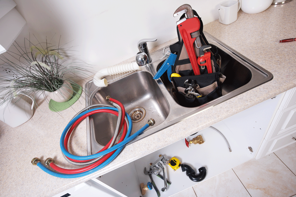 kitchen sink full of tools | plumbing service katy tx sugarland tx 