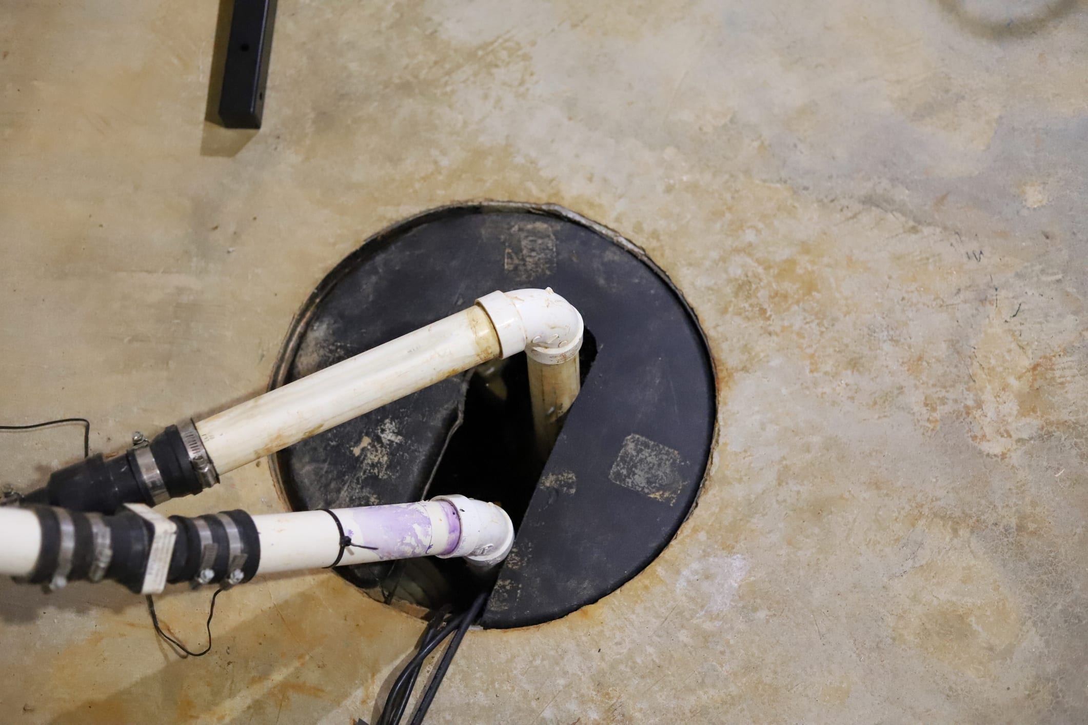 A sump pump installation in a home basement.
