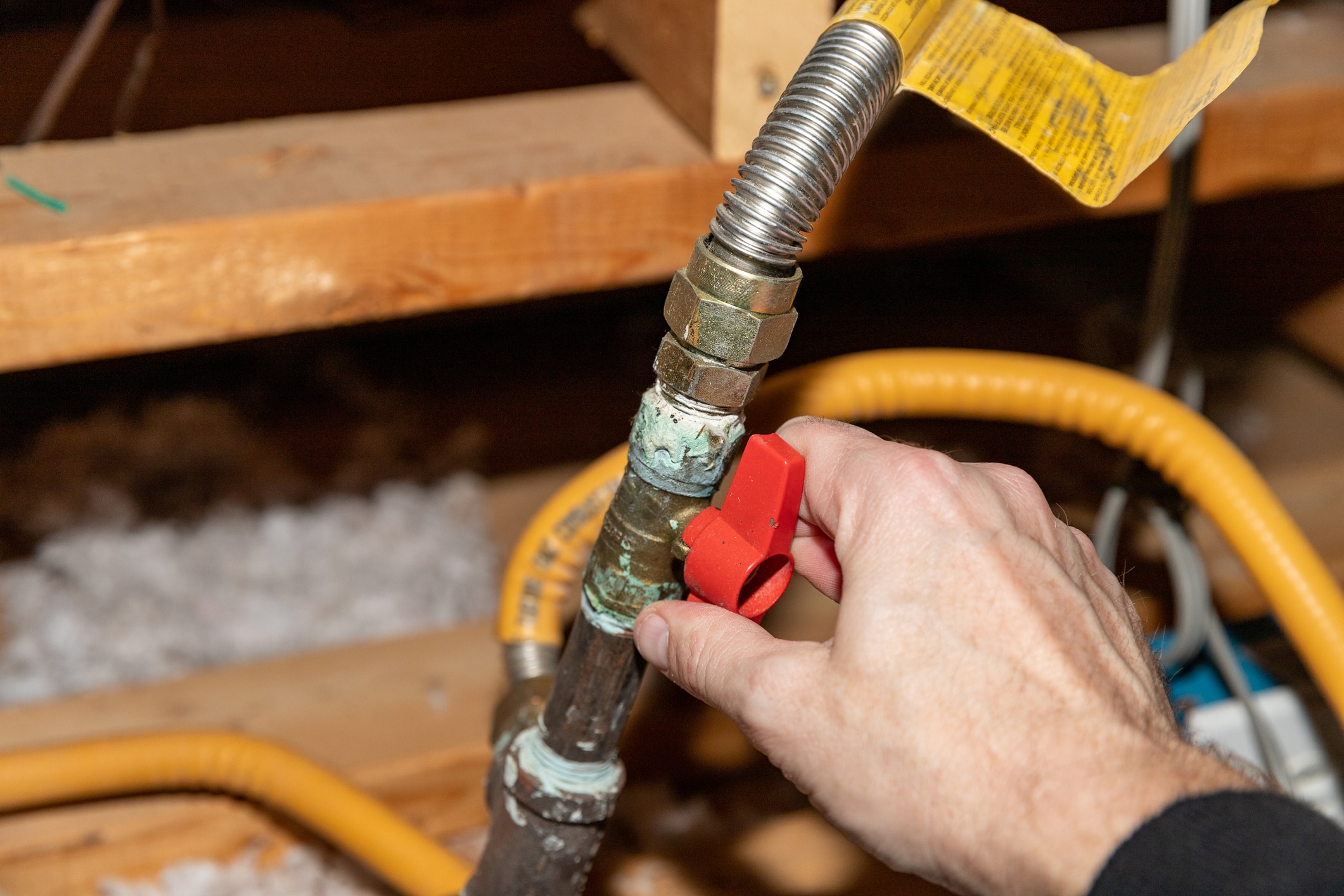 Hand turning safety shut off valve of a natural gas pipe, Gas Leak Safety.